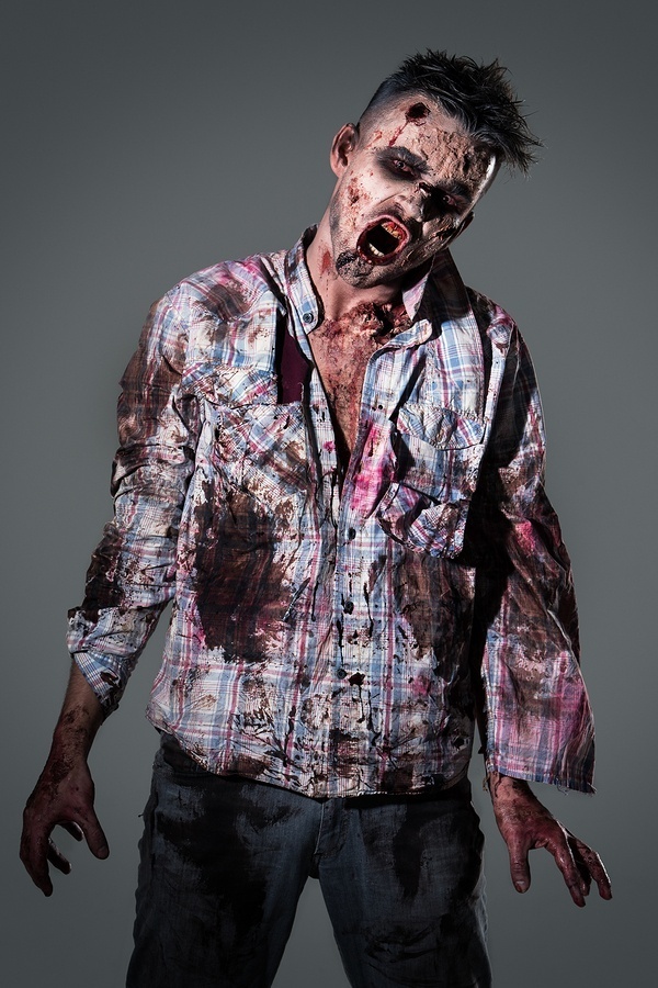 Aggressive, creepy zombie in clothes